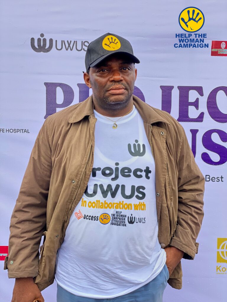 A Project UWUS campaigner at the campaign banner