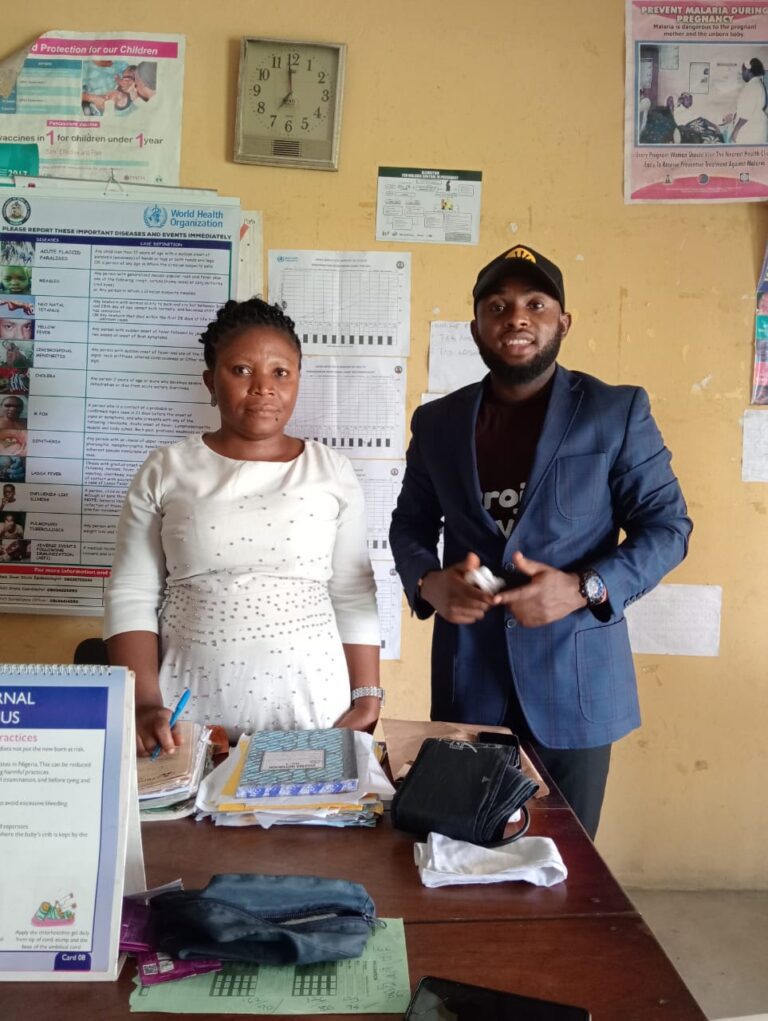 An HTWC team member with a health worker at a primary health centre